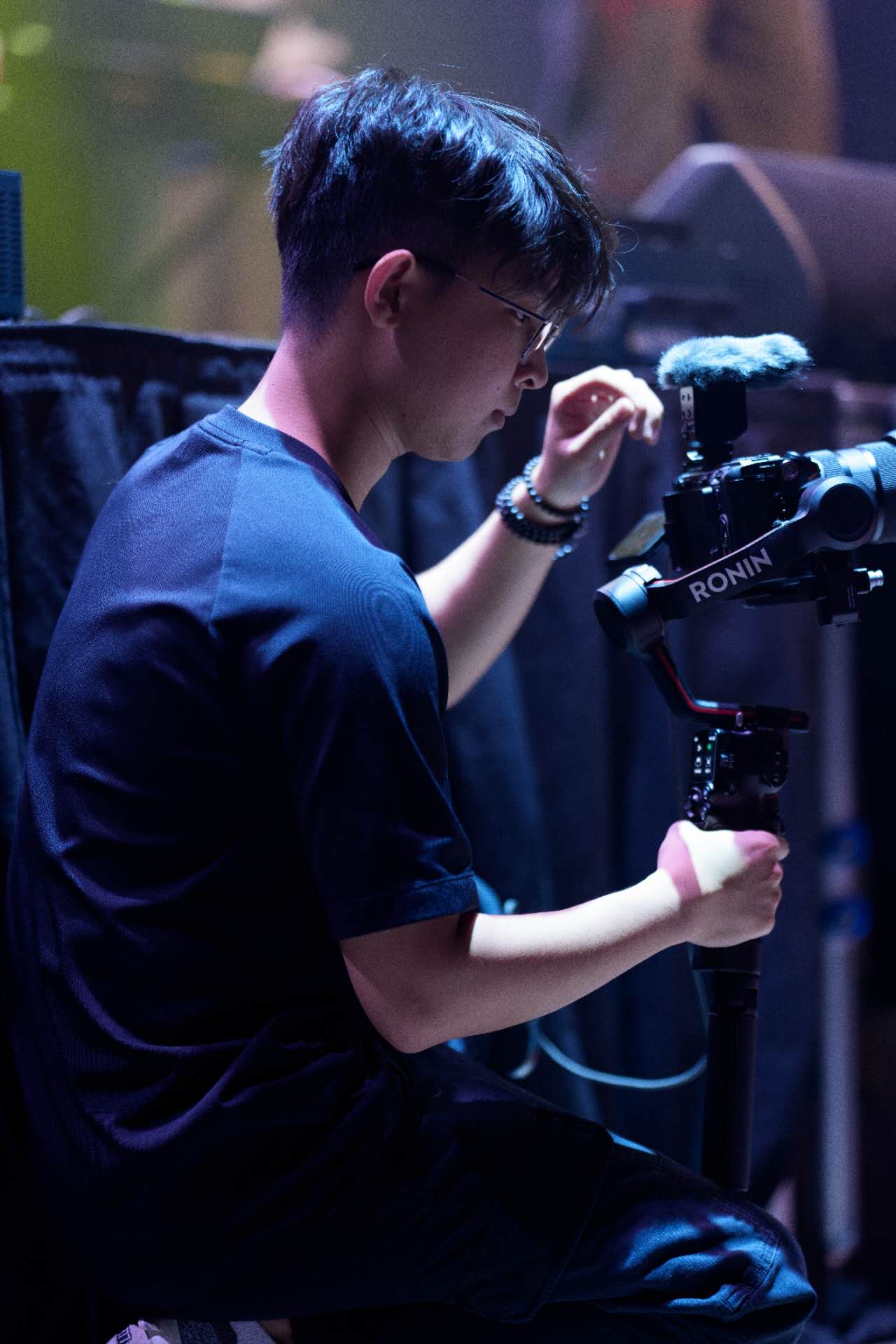 Shicheng operating a gimbal-stabilized camera on set.
